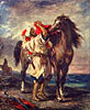 Marokkaner beim Satteln seines Pferdes